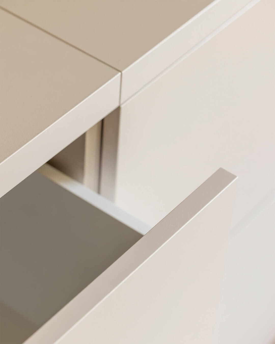 Detail of the drawer in a custom-made sideboard in the color Dune Beige