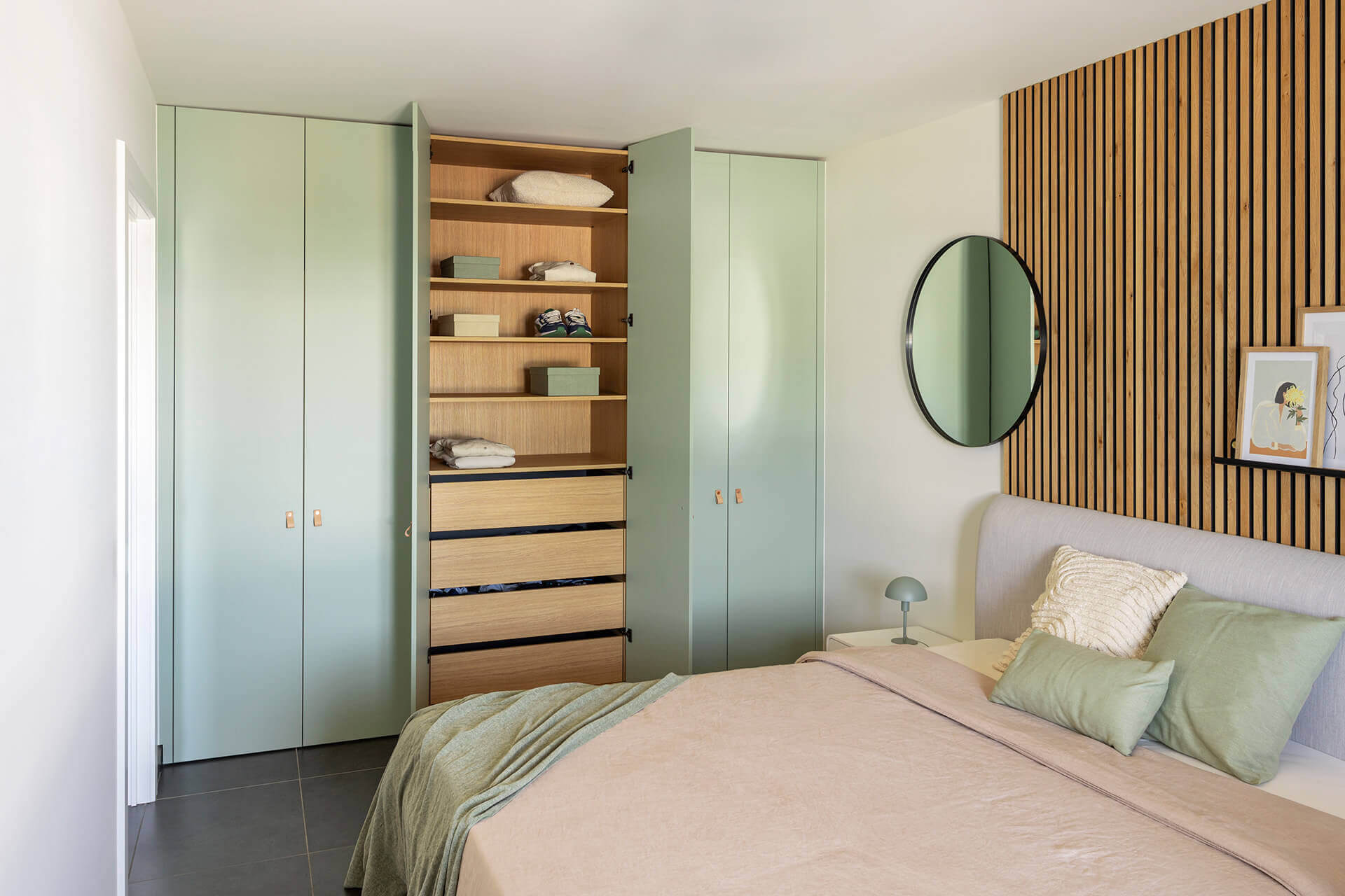 Custom closet in the color Industrial Green with an oak colored inside