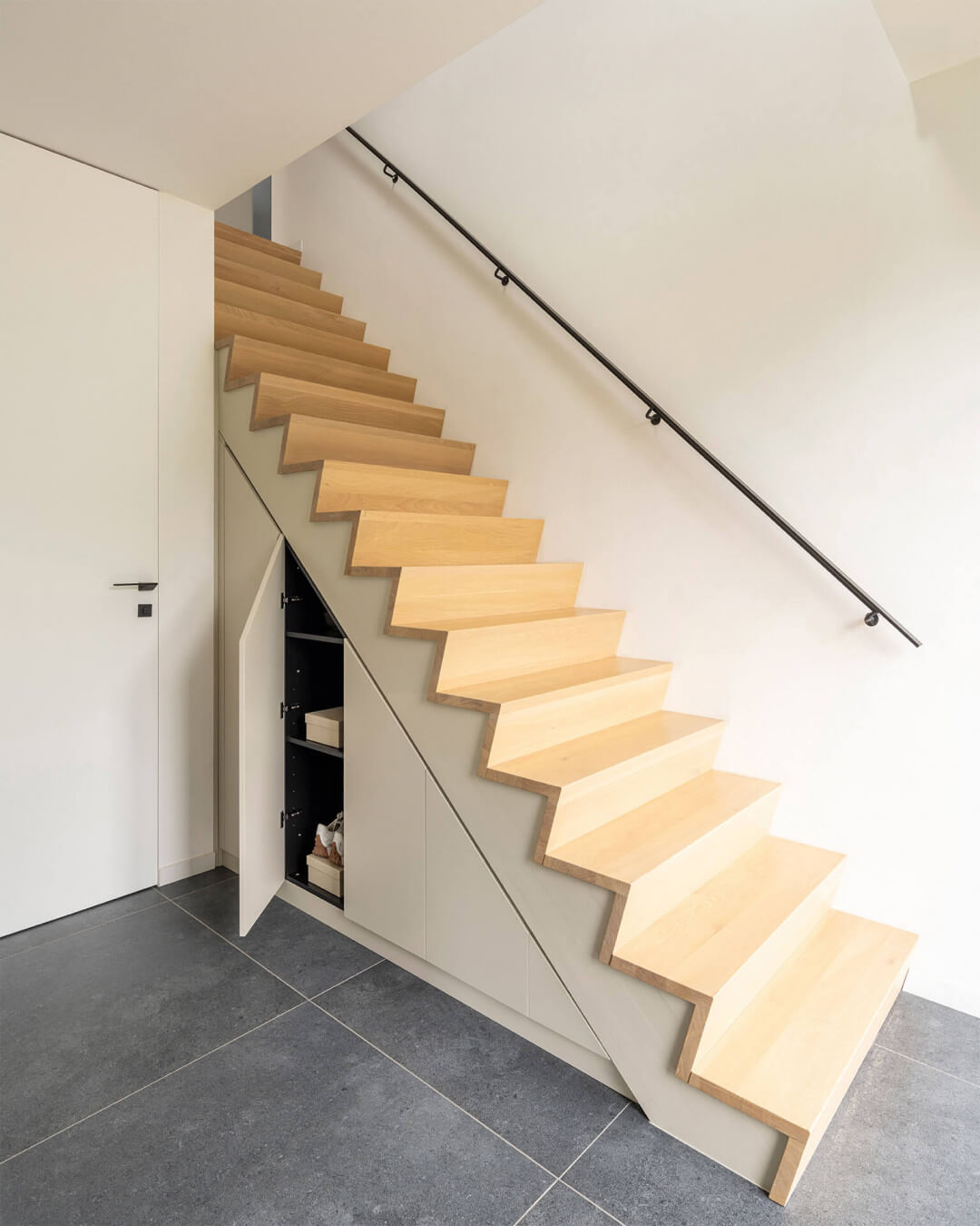 Custom staircase cabinet in the color Turtle Grey