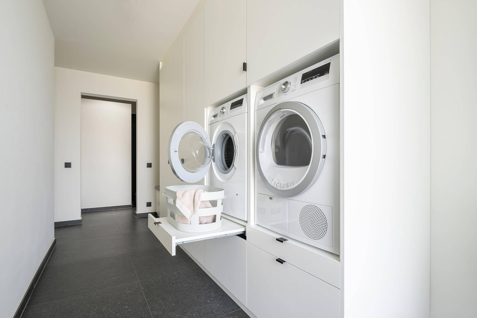 Custom laundry room design with a laundry cabinet