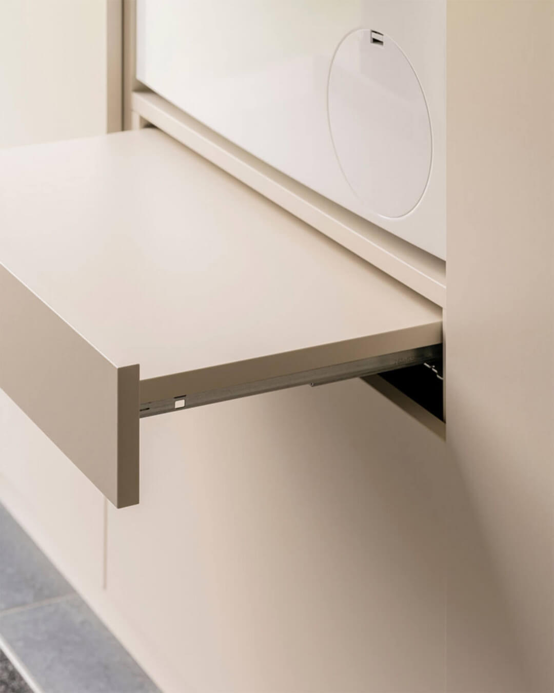 Pull-out shelf in a custom laundry cabinet