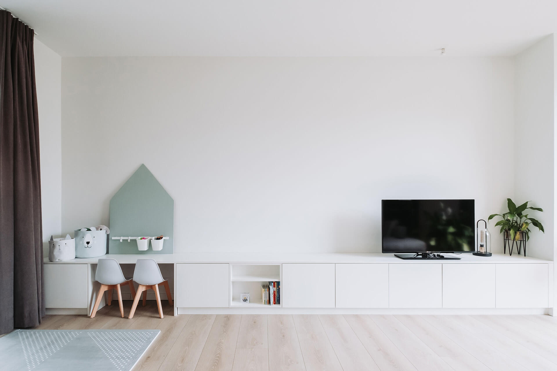 Customised TV cabinet next to children's desk