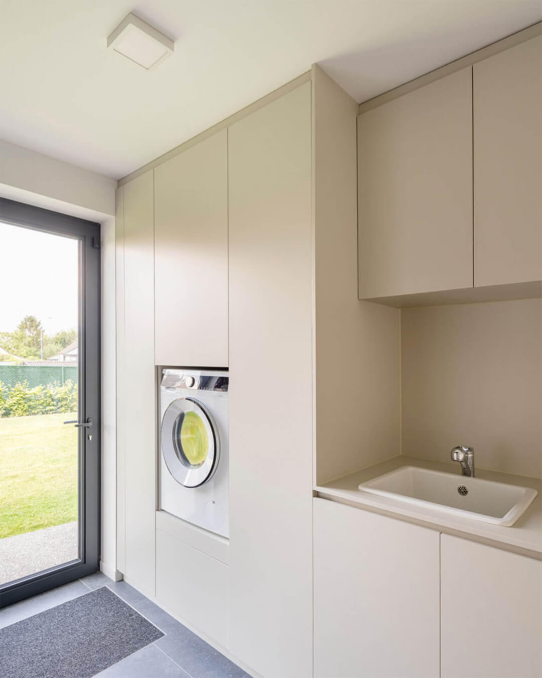 Laundry room with custom cabinets in the color Turtle Grey