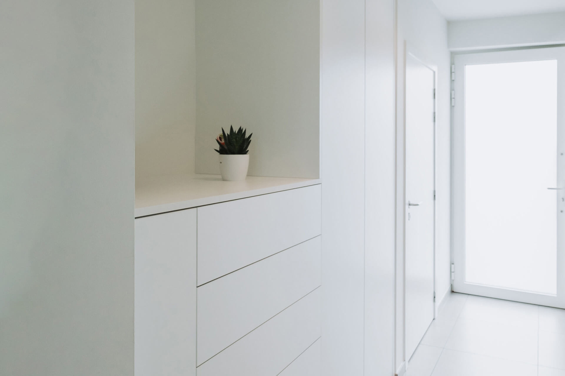 Wall combination as storage unit in front white