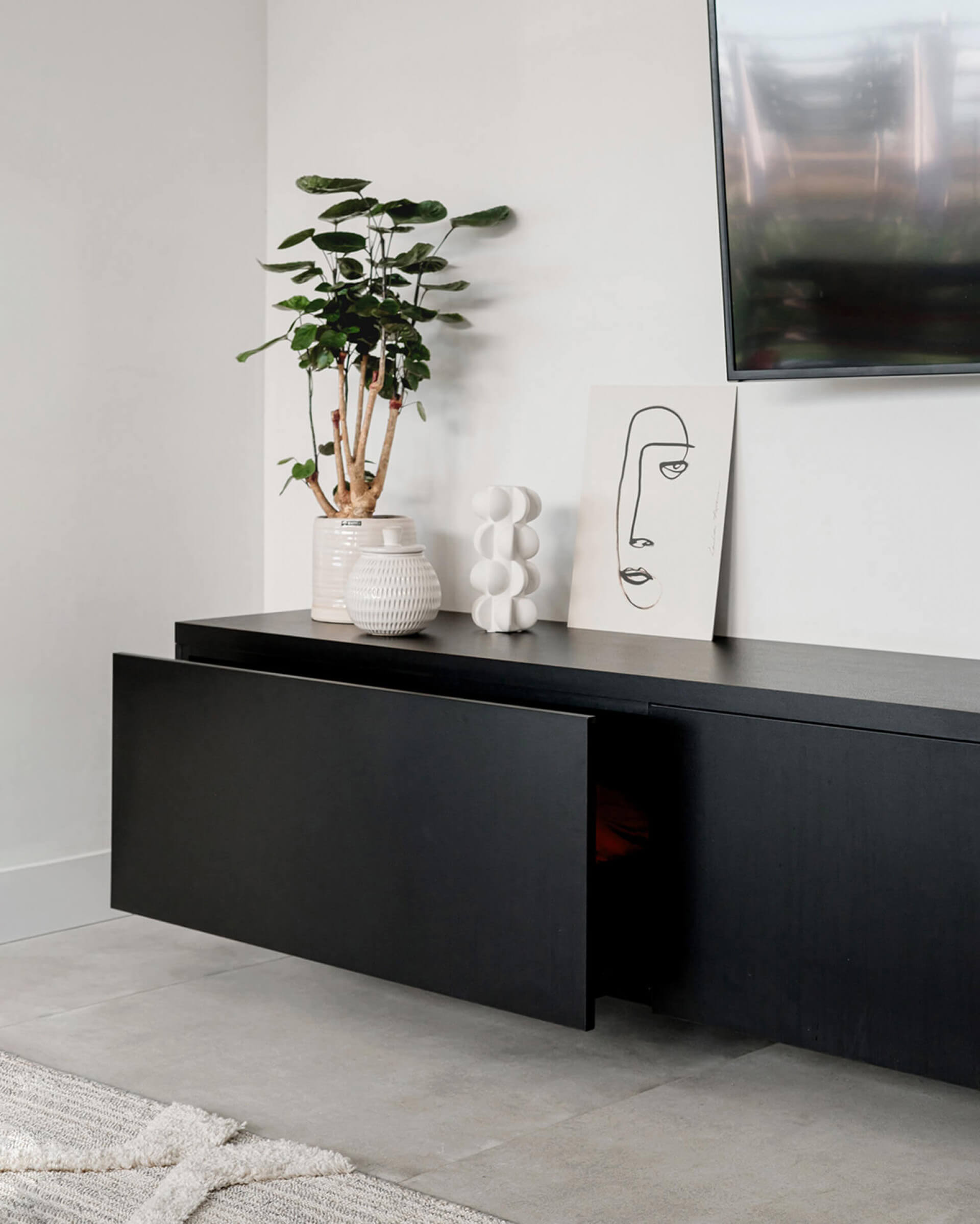 Customised black TV cabinet with drawer and push-to-open doors