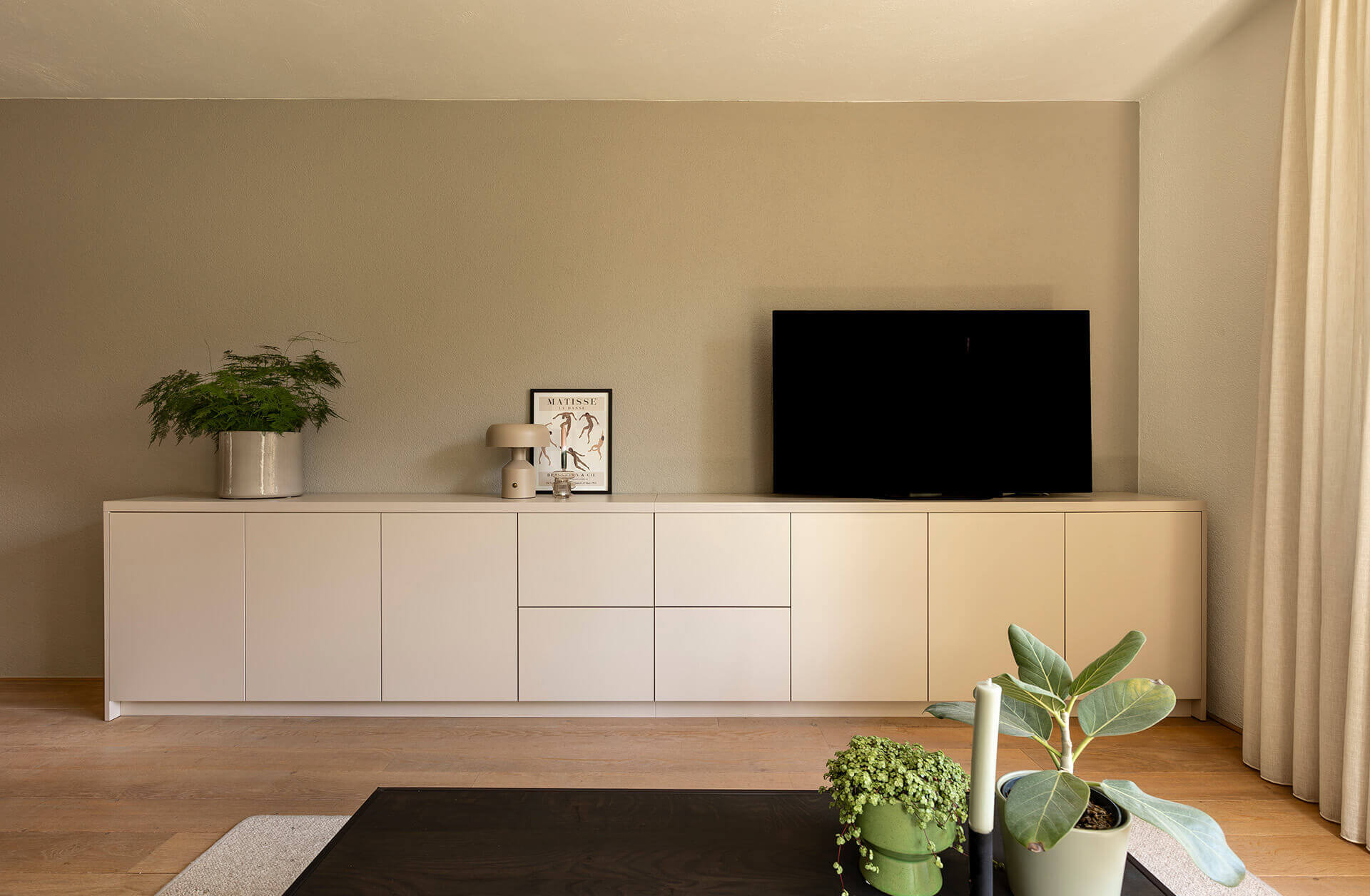 Custom-made sideboard or TV cabinet in the sitting area in the color Dune Beige