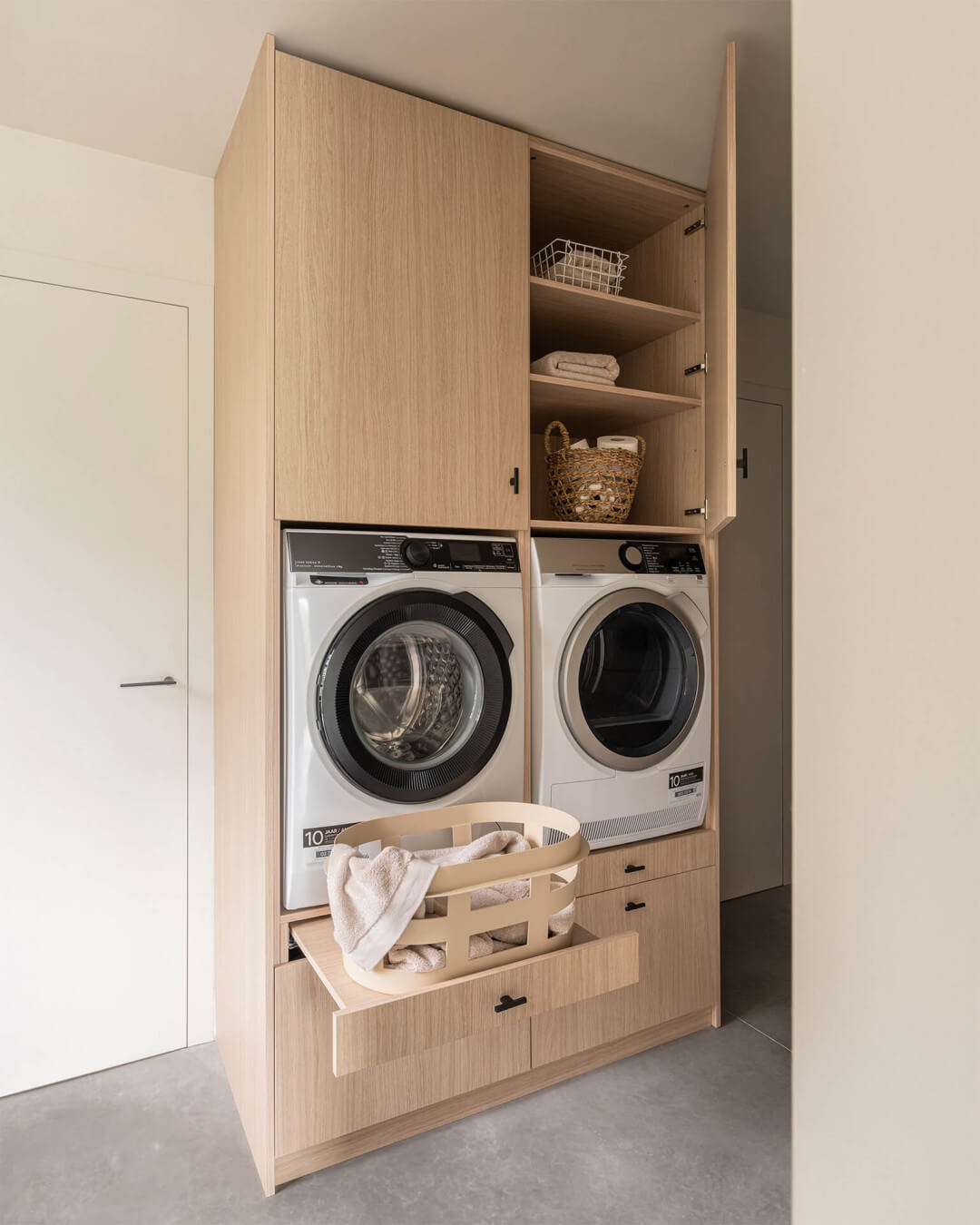 Custom laundry cabinet in the wood tone Atlas Oak