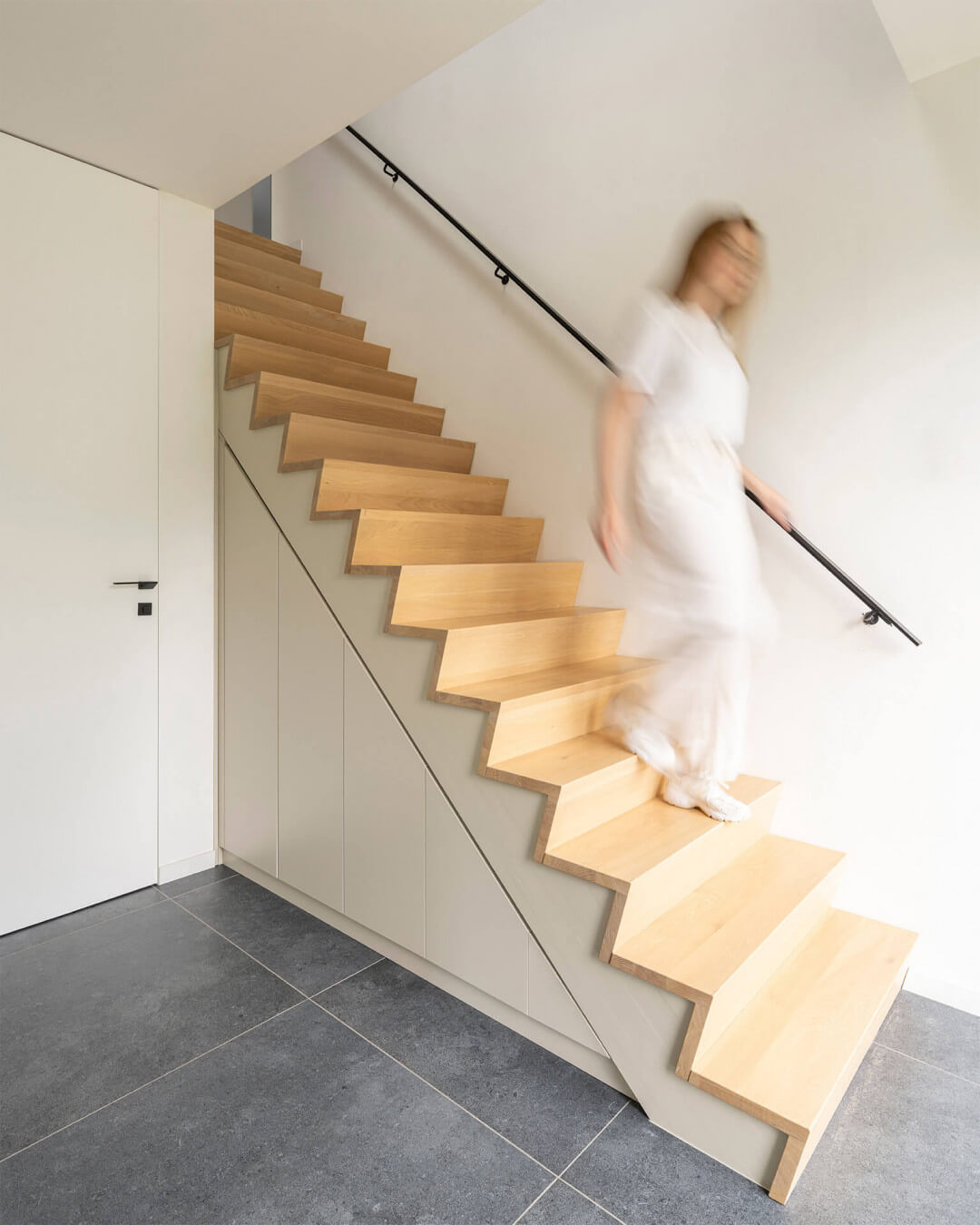 Custom staircase cabinet in the color Turtle Grey