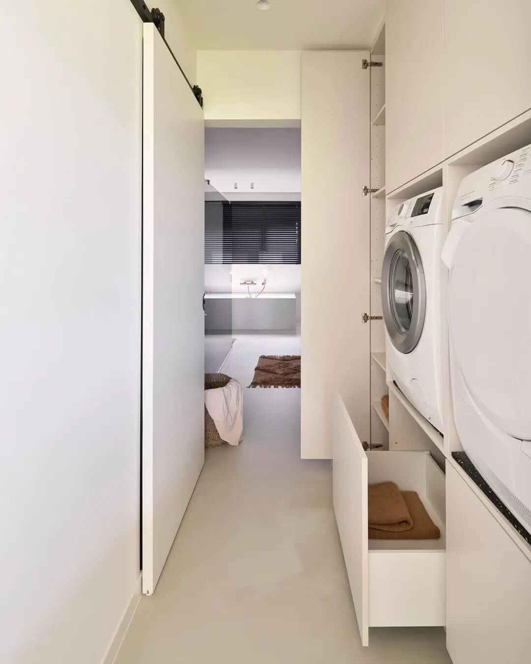 Laundry room with custom cabinets for the washing machine in the color Seashell