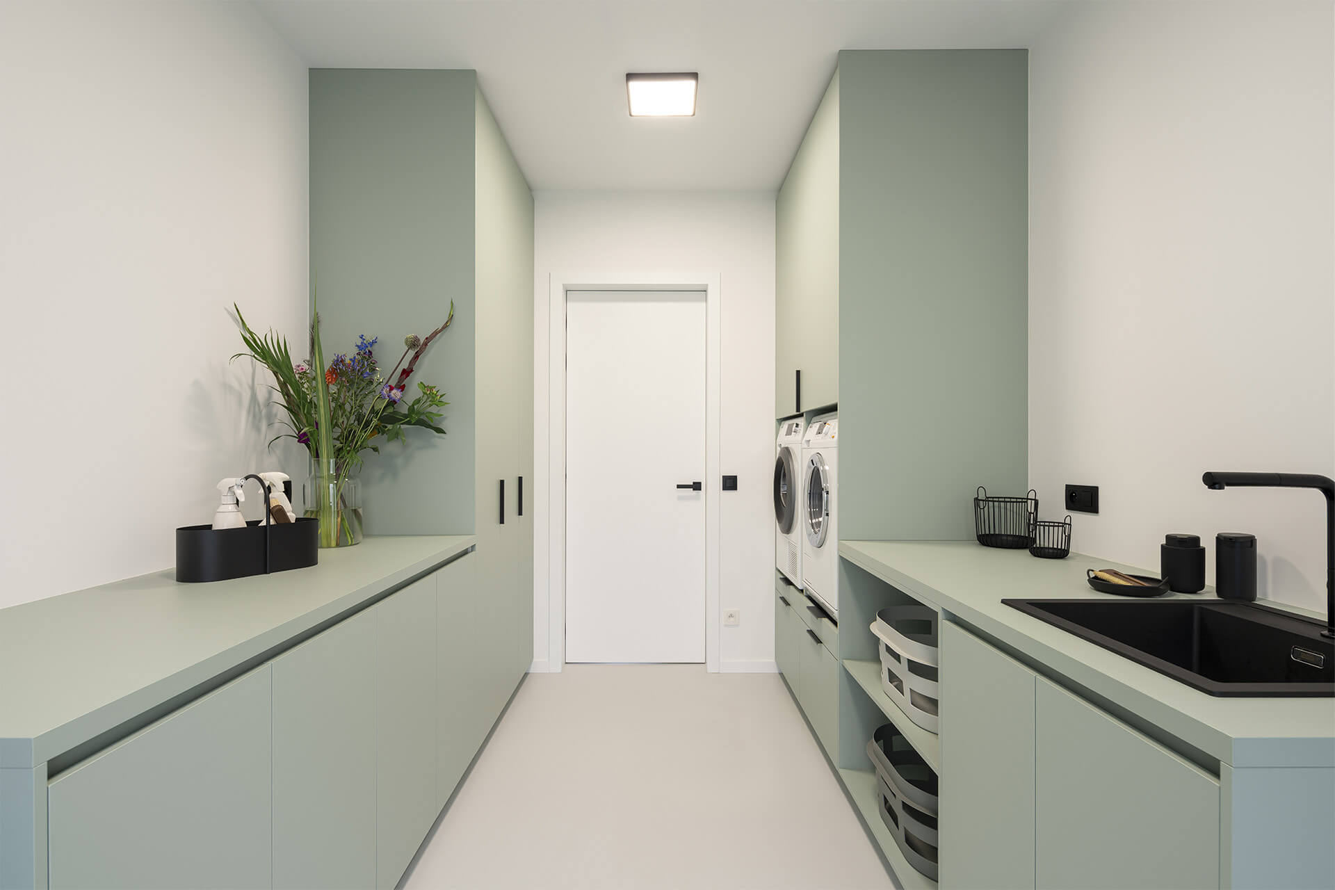 Washroom with bespoke cabinets in Industrial Green