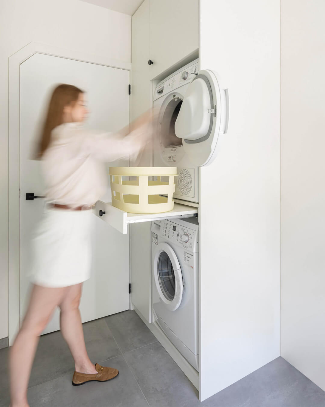 Custom laundry cabinet with pull-out shelf for the laundry basket