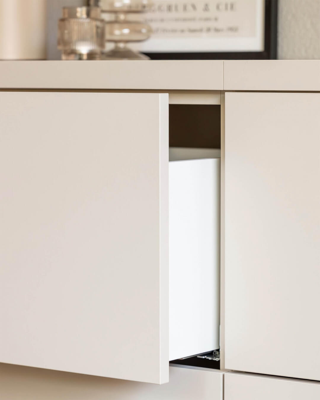 Detail of the drawer of a custom-made sideboard in the color Dune Beige