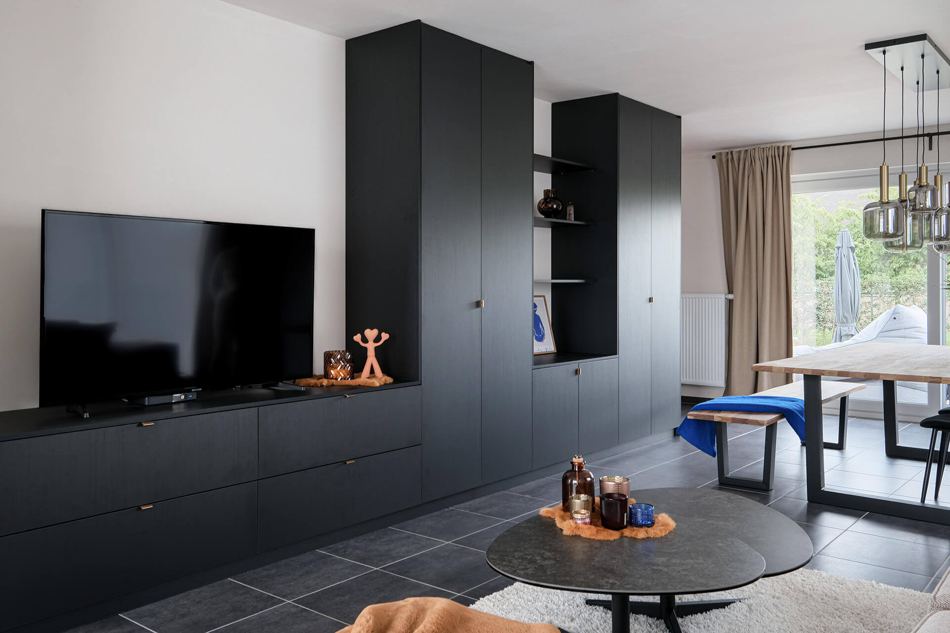 Customised black wall unit for TV