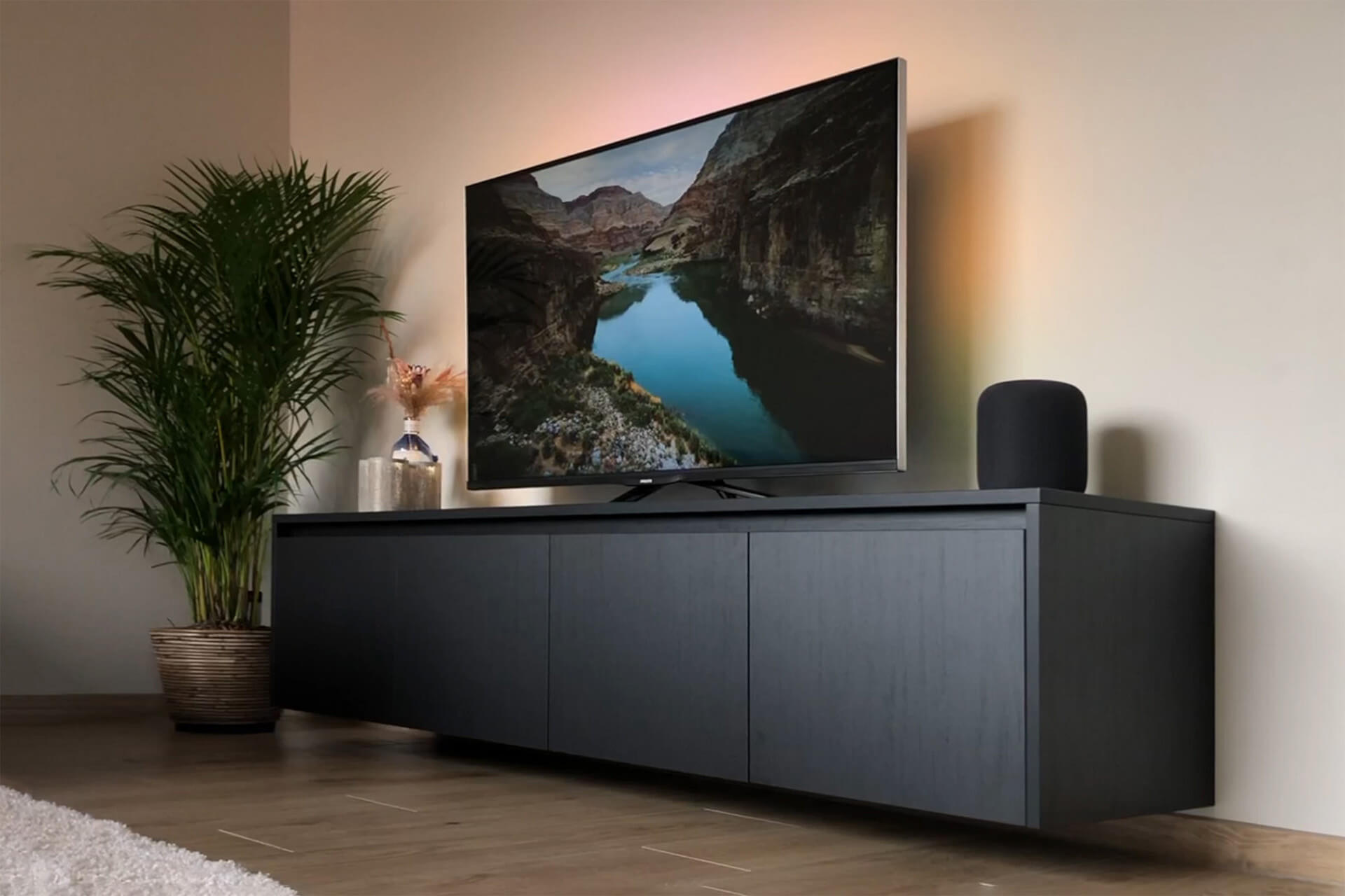 Made-to-measure floating TV unit in black and wood